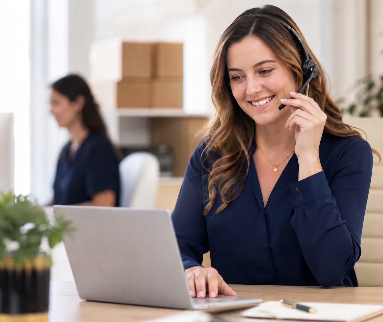 Friendly Top Tier moving coordinator helping a customer by phone